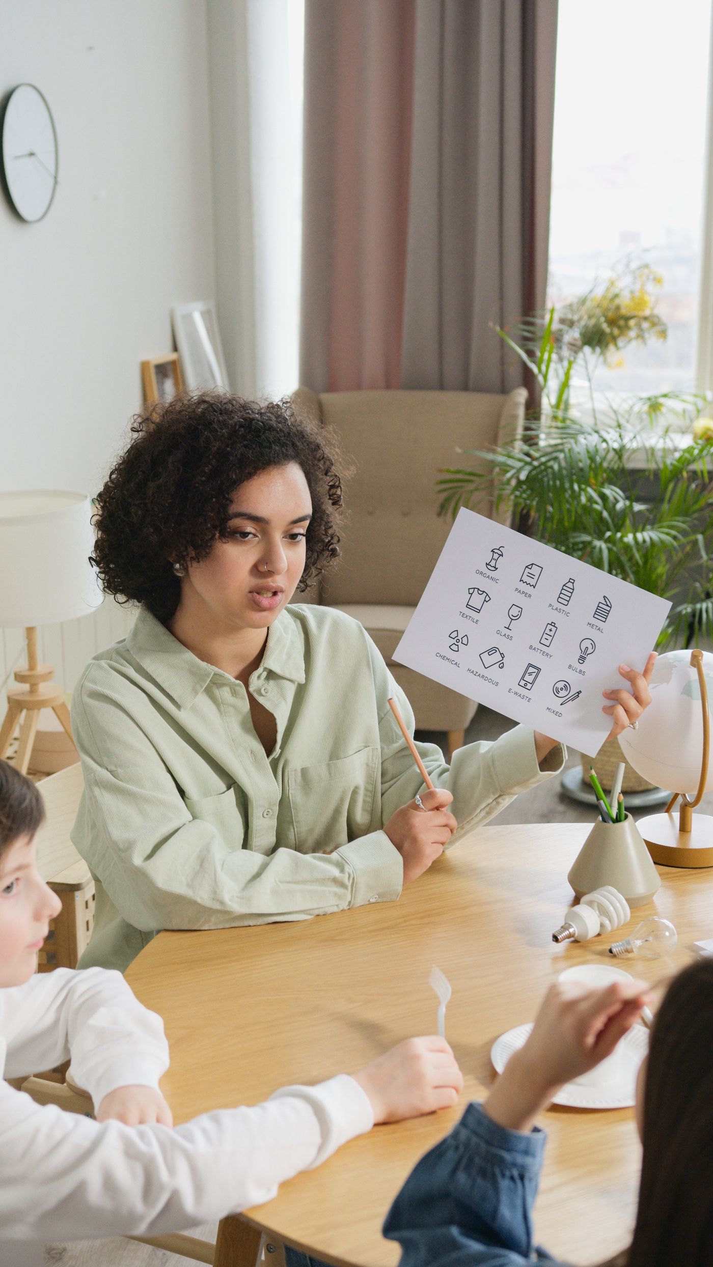 A teacher working with students in a classroom